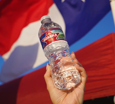 ozarka spring water next to texas flag