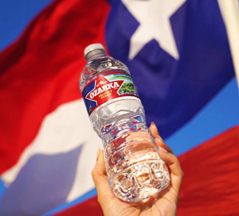 ozarka spring water next to texas flag