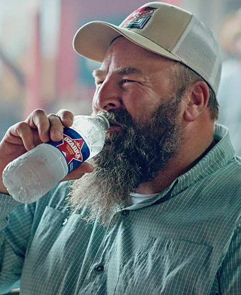 person holding a bottle of ozarka spring water person holding a bottle of ozarka spring water